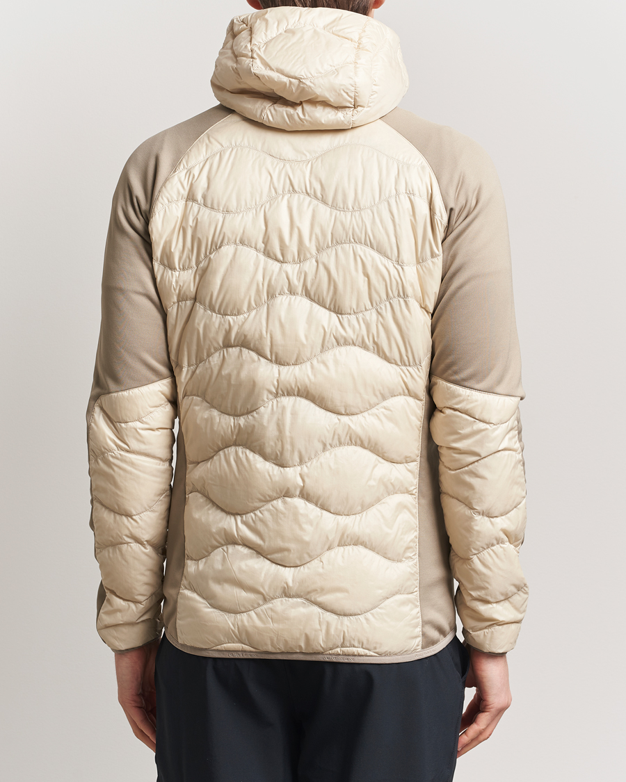 Heren | Jassen | Peak Performance | Helium Down Hooded Hybrid Jacket Sand Fog